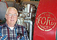 Dr. Bill Splinter with red Ford tractor