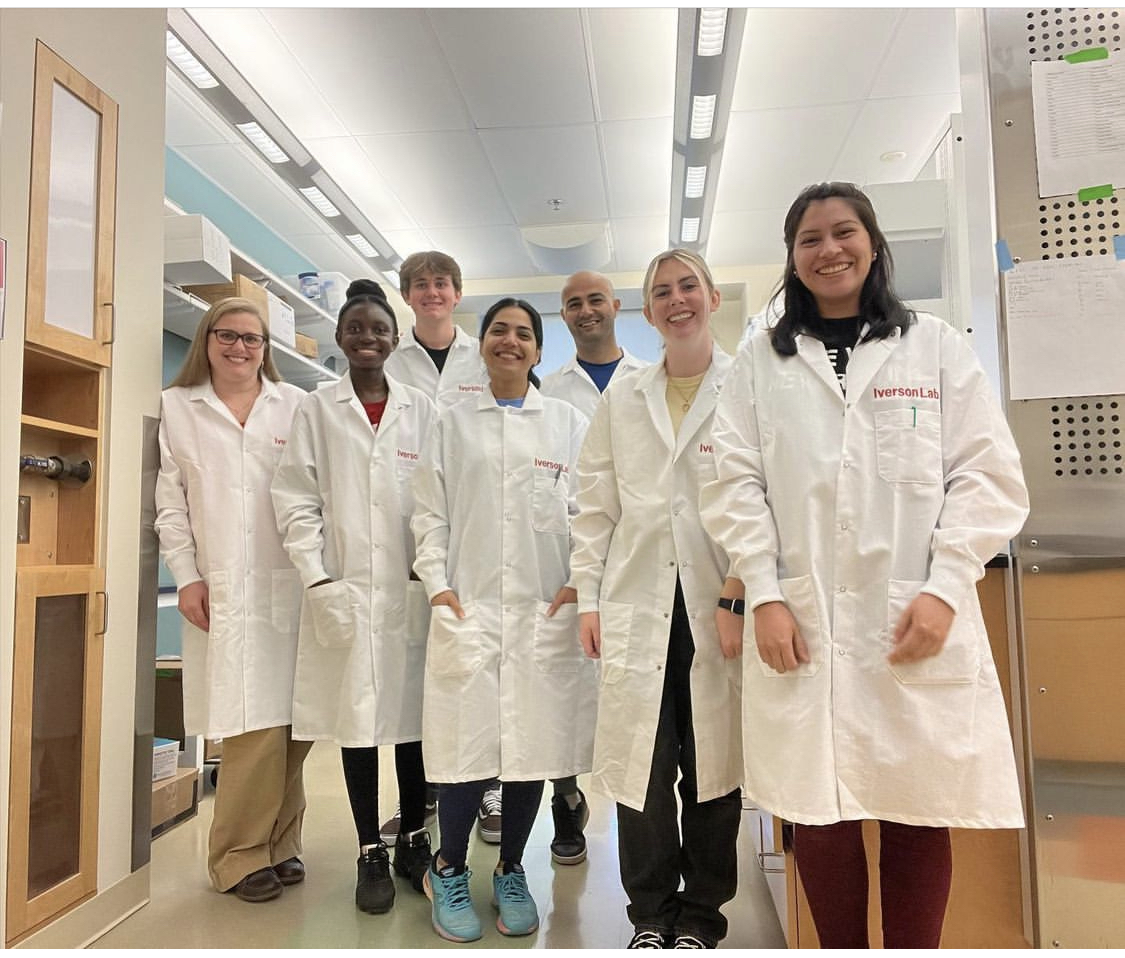 Image of Dr. Iverson with students in her lab