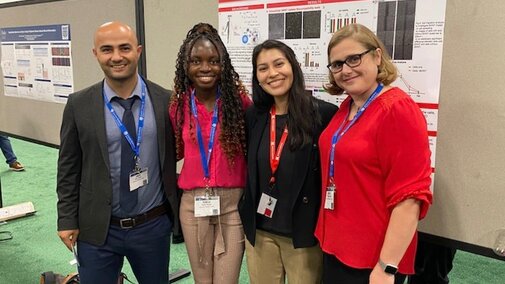 Dr. Iverson, Omer, Portia, and Ivon at BMES in front of Portia's Poster titled 'Organelle Colocalization of Single Walled Carbon Nanotube Sensors in Cancer Cells for Nitric Oxide Quantification'. (October 2023)