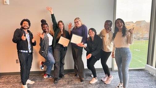Lab mates and Doctor Iverson share a photo at The Women of Courage, Character and Commitment, 2024