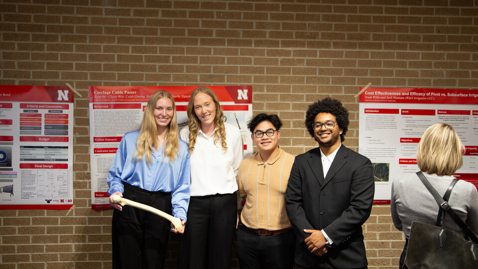 students presenting at a poster presentation event