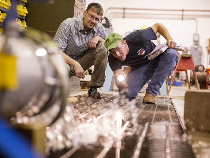two people testing an equipment