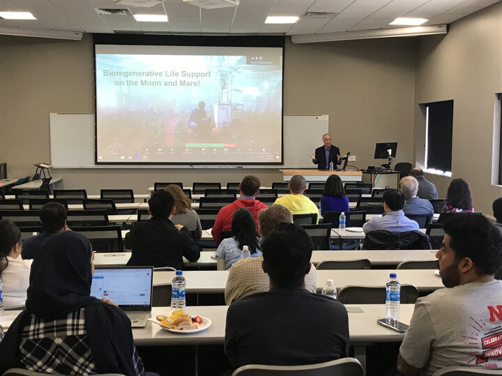 Dr. Wheeler presenting in front of a class